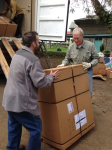 Tim and Dave carry (or roll) a PET.