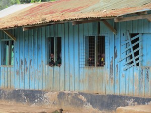 Children peering from windows. 