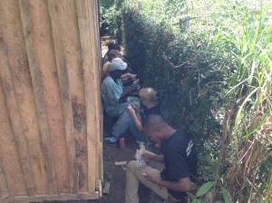 Having lunch in small space behind house. 
